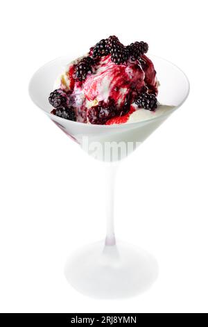 Fresh wild berries on top of vanilla ice cream isolated on a white background. Stock Photo