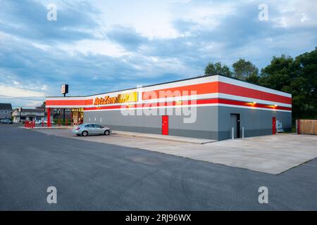 Yorkville, New York - Aug 9, 2023: Landscape Overcast View of AutoZone Auto Parts Store, which is the Largest Aftermarket Automotive Parts and Accesso Stock Photo