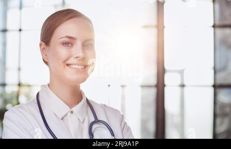Confident female doctor posing in her office Stock Photo