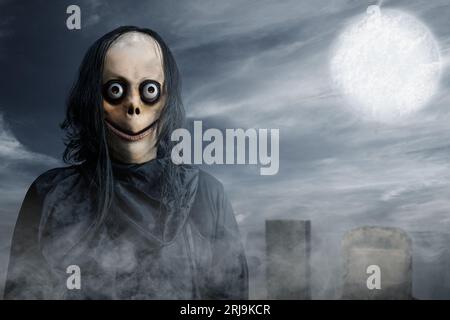 Scary Momo standing behind the wall in the dark background. Scary face for  Halloween. Halloween concept Stock Photo - Alamy