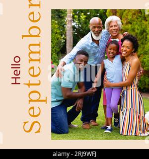 Composite of hello september text over african american multi generation family in garden Stock Photo