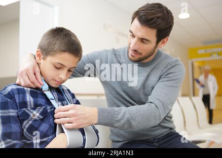father holding sick son in the hospital Stock Photo