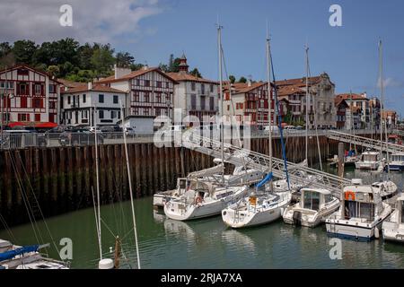 Family, visiting small town in France, Saint Jean de Luz, during summer vacation, traveling with children in Europe Stock Photo