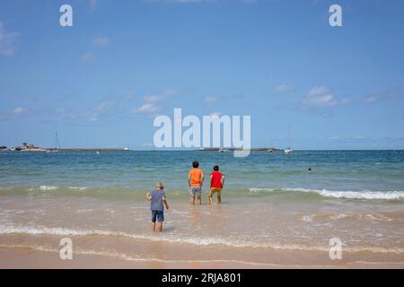 Family, visiting small town in France, Saint Jean de Luz, during summer vacation, traveling with children in Europe Stock Photo