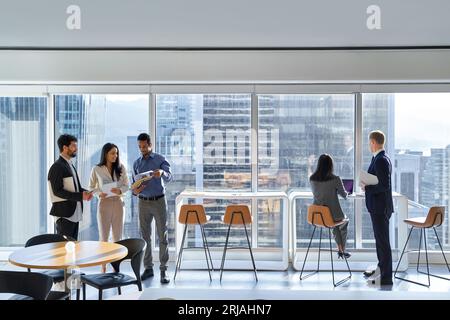 Diverse professional team business people workers working in corporate office. Stock Photo