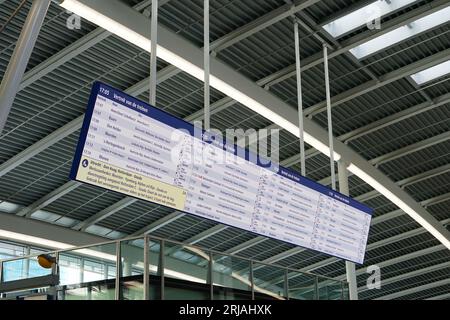 Utrecht, Netherlands - August 20, 2023: The large information screen in the central hall at railway station 'Utrecht Centraal' Stock Photo