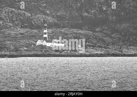 Black And White Photo Of The Cast Iron Constructed Landegode Lighthouse, Built In 1902, Located On The Small Island Of,18km North Of Bodø, Norway Stock Photo