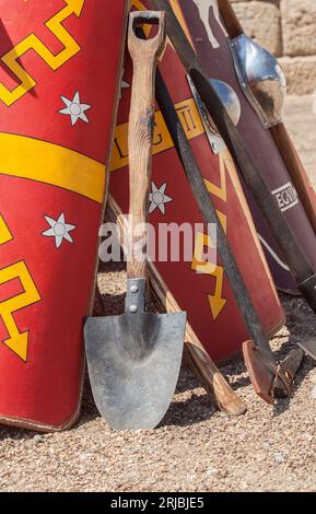 Entrenching tools supported in shields. Digging tools used by ancient roman army Stock Photo