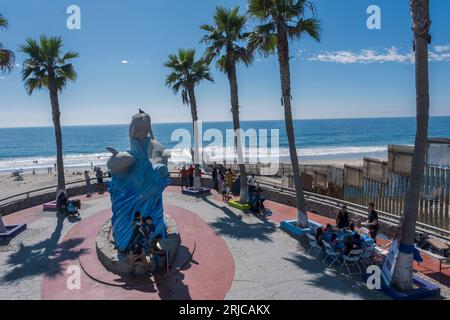 San Diego, USA. 18th Aug, 2023. Families spending time with each other in the Mexican beach community of Playas de Tijuana up against the American-built border wall. The wall extends into the ocean, on August 18, 2023. (Matthew Bowler/KPBS/Sipa USA) **NO SALES IN SAN DIEGO-SAN DIEGO OUT** Credit: Sipa USA/Alamy Live News Stock Photo