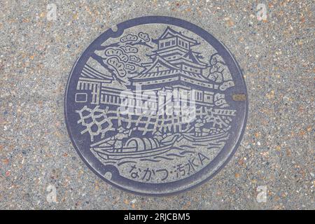 Nakatsu, Japan - Nov 26 2022: Picture of Nakatsu castle on a manhole cover in Nakatsu, Oita prefecture Stock Photo