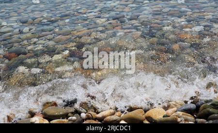 colourful pebbles on sea side Stock Photo