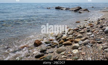 colourful pebbles on sea side Stock Photo