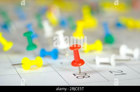 Booming business and prosperous enterprise concept,calendar with numerous pushpins and business appointments, selective focus Stock Photo