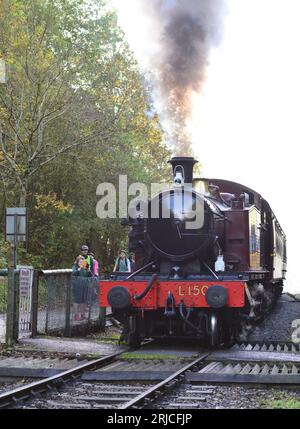 GWR class 4575 2-6-2 tank engine No 5521, running as London Transport No L150, passing over a footpath/cycle path crossing on the Avon Valley Railway. Stock Photo