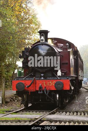 GWR class 4575 2-6-2 tank engine No 5521, running as London Transport No L150, passing over a footpath/cycle path crossing on the Avon Valley Railway. Stock Photo