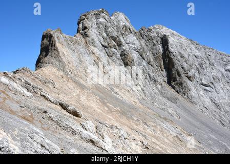 Tiros Navarro in the Picos de Europa, northern Spain, a triple peak rising from the Collado Santa Ana. Stock Photo