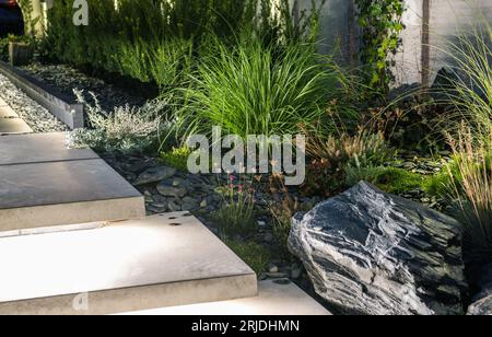 Elegant Rockery Garden and Garden Pathway Stairs Illuminated by LED Lights Stock Photo