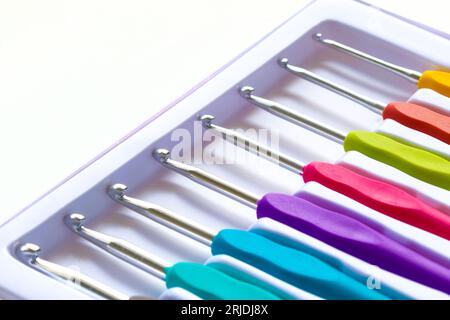 Close-up on crochet hooks set in different sizes with multicoloured handles Stock Photo