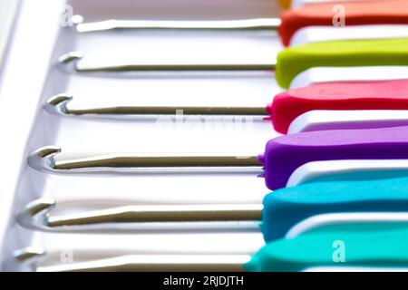 Close-up on crochet hooks set in different sizes with multicoloured handles Stock Photo