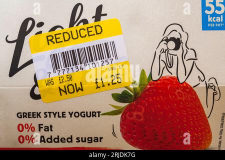 Yellow reduced sticker on multipack of Light & Free Greek style yogurts - half price - price reduction, price mark down Stock Photo