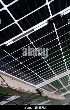Back side of solar panel, photovoltaic, alternative electricity source - concept of sustainable resources. Landscape of solar panels at solar power Stock Photo