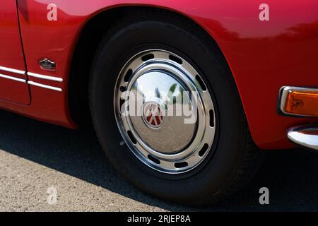 Waltershausen, Germany - June 10, 2023: Volkswagen Karmann Ghia. View of the wheel with the logo. Stock Photo