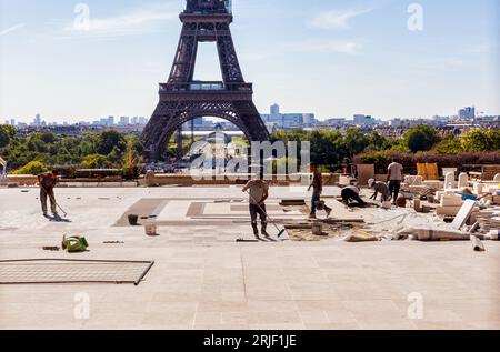 Paris, France - July 16, 2022: Construction worker in the Trocadero site with Eiffel tower on the background, Paris. France Stock Photo