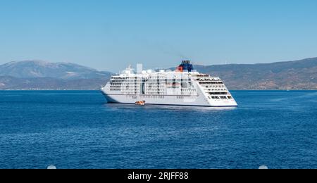 Hydra, Greece - Sept 9, 2022: Side view of luxury German cruise ship Hapag LLoyd MS Europa 2. Beautiful ship anchored in harbor of Hydra Island. Stock Photo