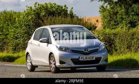 Woburn,Beds.UK - August 19th 2023: 2014 silver Toyota Yaris  car travelling on an English country road. Stock Photo