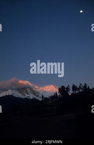 Peru, Andes Montain Range - Cordillera de los Andes, Cordillera Blanca.  Dusk on snow-covered slopes of Mount Huascarán (6768 m), highest mountain in Peru Stock Photo