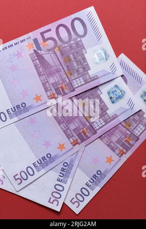 500 euro banknotes on a red background. close up Stock Photo
