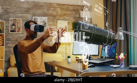 Cad expert manufacturing machine product parts on computer using augmented reality technology, working on industrial machinery production assisted by innovative engineering VR application Stock Photo