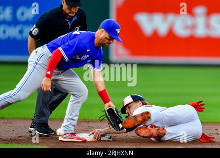 Baltimore, United States. 22nd Aug, 2023. Baltimore Orioles' Gunnar Henderson (R) safely steals second base ahead of the attempted tag by Toronto Blue Jays second baseman Whit Merrifield (15) during the first inning at Camden Yards in Baltimore, MD, on Tuesday, August 22, 2023. Photo by David Tulis/UPI Credit: UPI/Alamy Live News Stock Photo
