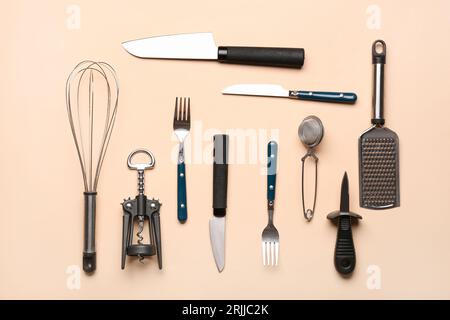 https://l450v.alamy.com/450v/2rjjc2k/set-of-kitchen-utensils-on-beige-background-2rjjc2k.jpg