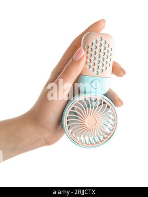 Female hand with mini electric fan on white background Stock Photo