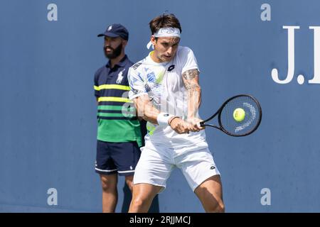 New York, USA. 22nd Aug, 2023. Camilo Ugo Carabelli of Argentina returns ball during 1st round match against Federico Coria of Argentina of qualifying for US Open Championship at Billy Jean King Tennis Center in New York on August 22, 2023 Credit: Sipa USA/Alamy Live News Stock Photo