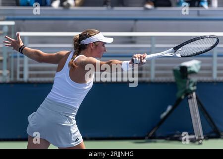 Mary Stoiana of USA returns ball during 1st round match against Victorija Golubic of Switzerland of qualifying for US Open Championship at Billy Jean King Tennis Center in New York on August 22, 2023 Stock Photo