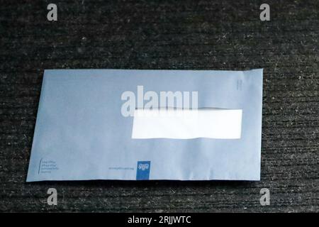 The infamous blue envelope from the Dutch Tax Administration with tax assessment in the Netherlands Stock Photo