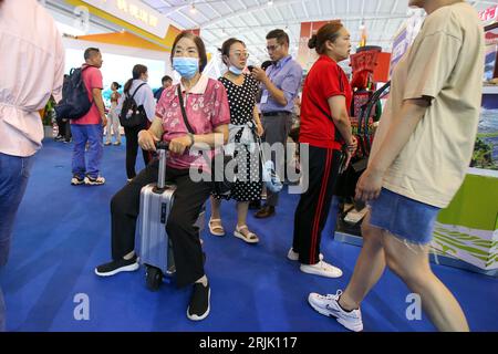 People visit the 7th China-South Asia Expo in Kunming City, southwest China's Yunnan Province, 20 August, 2023. Stock Photo