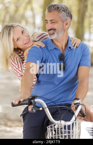 happy active senior couple with bicycles enjoying summer Stock Photo