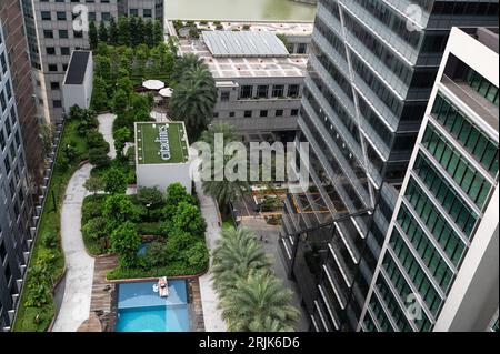 01.08.2023, Singapore, Republic of Singapore, Asia - View from Green Oasis observation deck of CapitaSpring skyscraper to rooftop terrace with pool. Stock Photo