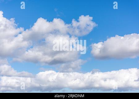 White cumulus clouds against blue sky, Seaburn, Sunderland, Tyne and Wear, England, United Kingdom Stock Photo