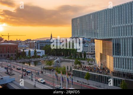 Oslo, Norway, June 20, 2023: Tourists view a sunset from the Oslo Public Library, Norway's first and largest library. The modern library only contains Stock Photo