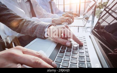 business man working on laptop computer at modern office. Stock Photo