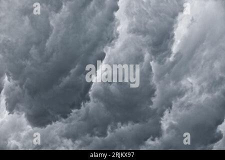 Dark clouds before the rain, used to make a background image. Dramatic sky with dark storm clouds. Stock Photo