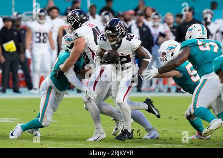 Atlanta Falcons running back Godwin Igwebuike sprints through Miami  Dolphins for an 11-yard TD run