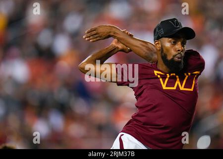 A Washington Commanders cheerleader performs during the first half of an  NFL preseason football game between the Washington Commanders and the  Baltimore Ravens, Monday, Aug. 21, 2023, in Landover, Md. The Commanders