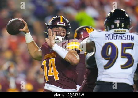 Baltimore Ravens linebacker Tavius Robinson (95) runs during an