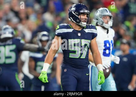 Seattle Seahawks linebacker Patrick O'Connell (57) carries the ball during  a Back Together Weekend event at the NFL football team's training  facility, Sunday, July 30, 2023, in Renton, Wash. (AP Photo/Lindsey Wasson