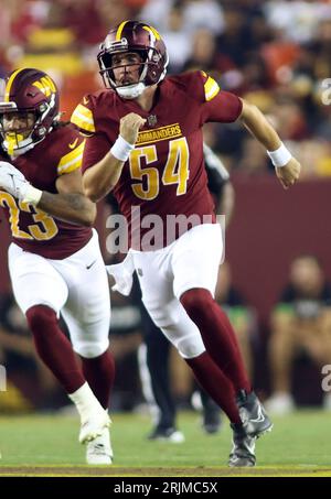 Washington Commanders long snapper Camaron Cheeseman (54) reacts during the  second half of an NFL football game against the Chicago Bears, Thursday,  Oct. 13, 2022, in Chicago. (AP Photo/Kamil Krzaczynski Stock Photo - Alamy